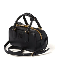 Miu Miu Small bag with brand logo brooch Miu Miu Small bag with brand logo brooch
