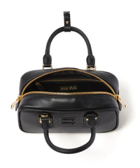 Miu Miu Small bag with brand logo brooch Miu Miu Small bag with brand logo brooch