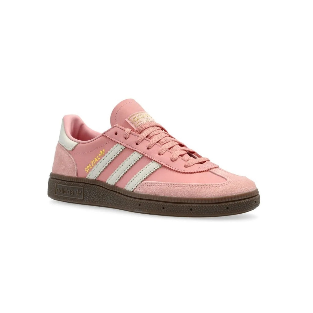 All About Pink Adidas sneaker with three white stripes