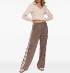 All About Pink Adidas sneaker with three white stripes