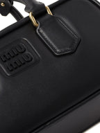 Miu Miu Small bag with brand logo brooch