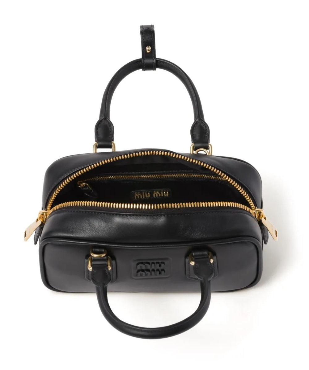 Miu Miu Small bag with brand logo brooch