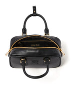 Miu Miu Small bag with brand logo brooch