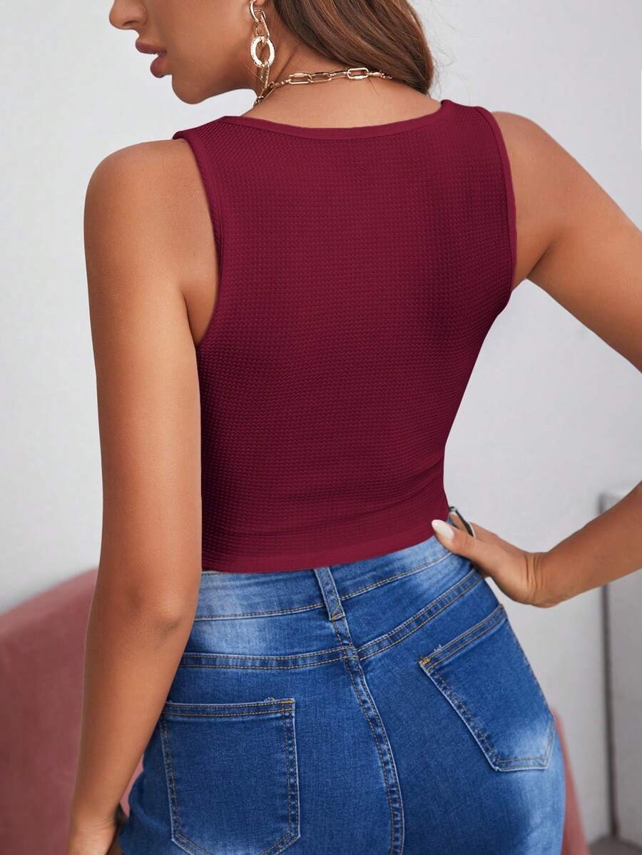 Women's Sleeveless Solid Color Asymmetrical Hem Shirt