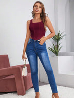 Women's Sleeveless Solid Color Asymmetrical Hem Shirt